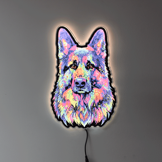 A colorful LED neon-style wall light shaped like a German Shepherd dog face, glowing with a multicolor neon pattern against a plain gray wall.