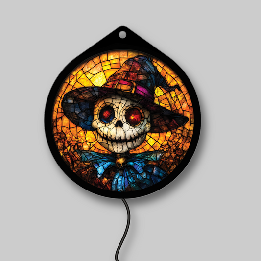 Pumpkin-head scarecrow LED sign glowing brightly against a dark background