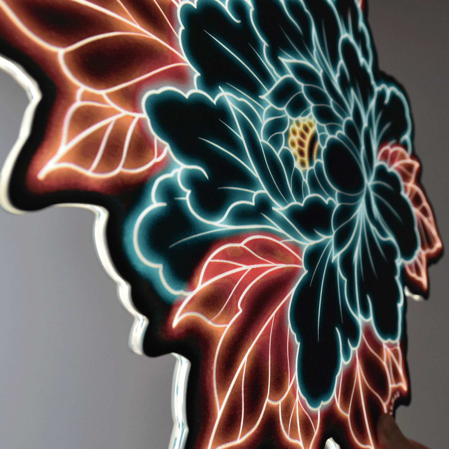 Original Peony tattoo design at an angle by Bryce Bowerman printed on acrylic with UV printer with added LED light on in lighted room
