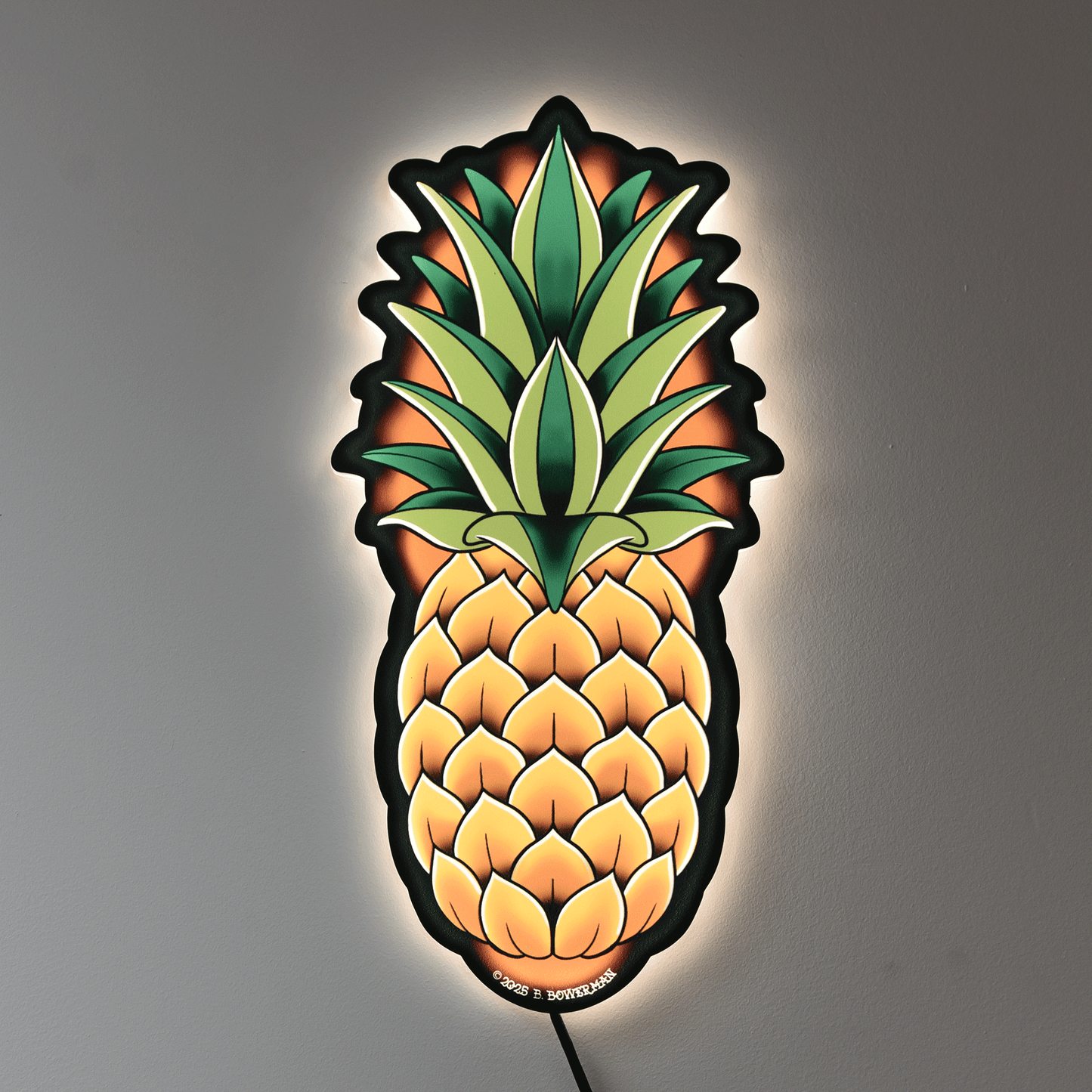 Original medium size Pineapple design by Bryce Bowerman printed on acrylic with UV printer with added LED light on in lighted room