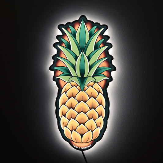Original large size pineapple design by Bryce Bowerman wall light on in a dark room to show powerful illumination