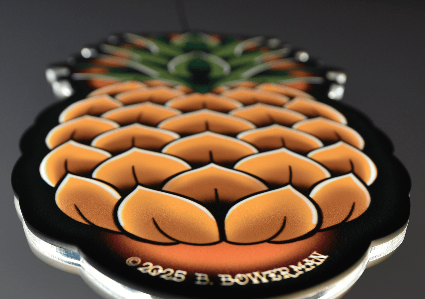 Original medium size Pineapple tattoo design at an angle by Bryce Bowerman printed on acrylic with UV printer with added LED light on in dark room.
