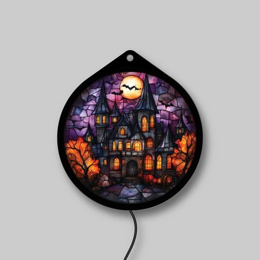 Haunted gothic manor faux stained glass LED sign with bats and full moon, lights off