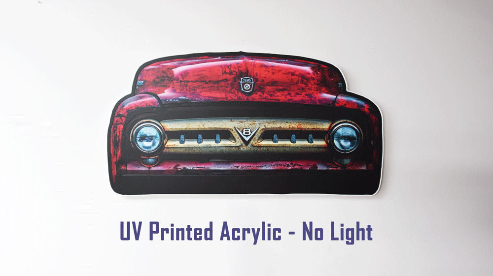A die-cut acrylic wall sign depicting the front of a 1953 F100 grille with red body color with a distressed weathered finish. The sign is displayed against a plain white background with purple text below reading 'UV Printed Acrylic - No Light'.