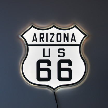 LED sign shaped like a highway shield with 'Arizona US 66' text on a dark background