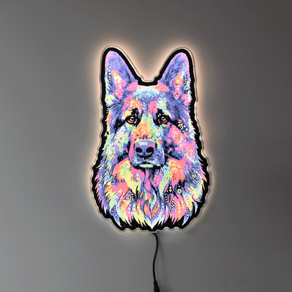 A colorful LED neon-style wall light shaped like a German Shepherd dog face, glowing with a multicolor neon pattern against a plain gray wall.