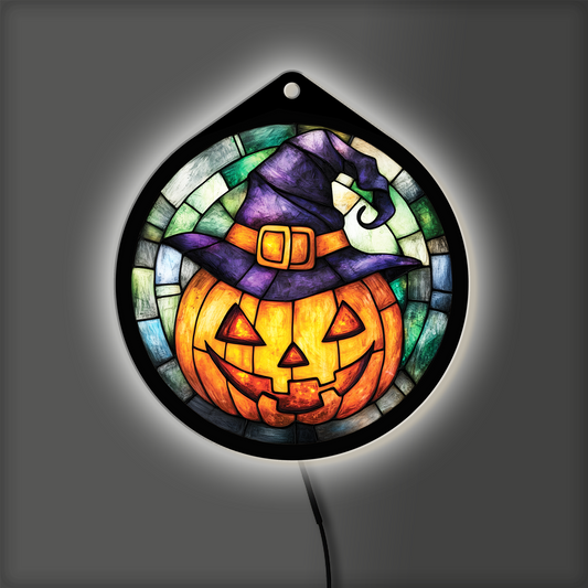 Jack-o'-lantern witch hat LED sign glowing with backlight on, purple hat and orange pumpkin lit
