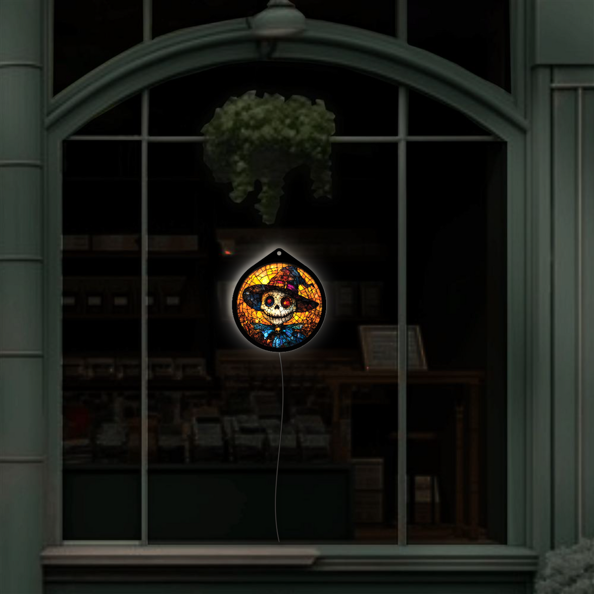 Pumpkin-head scarecrow sign unlit in a shop window display, wide view