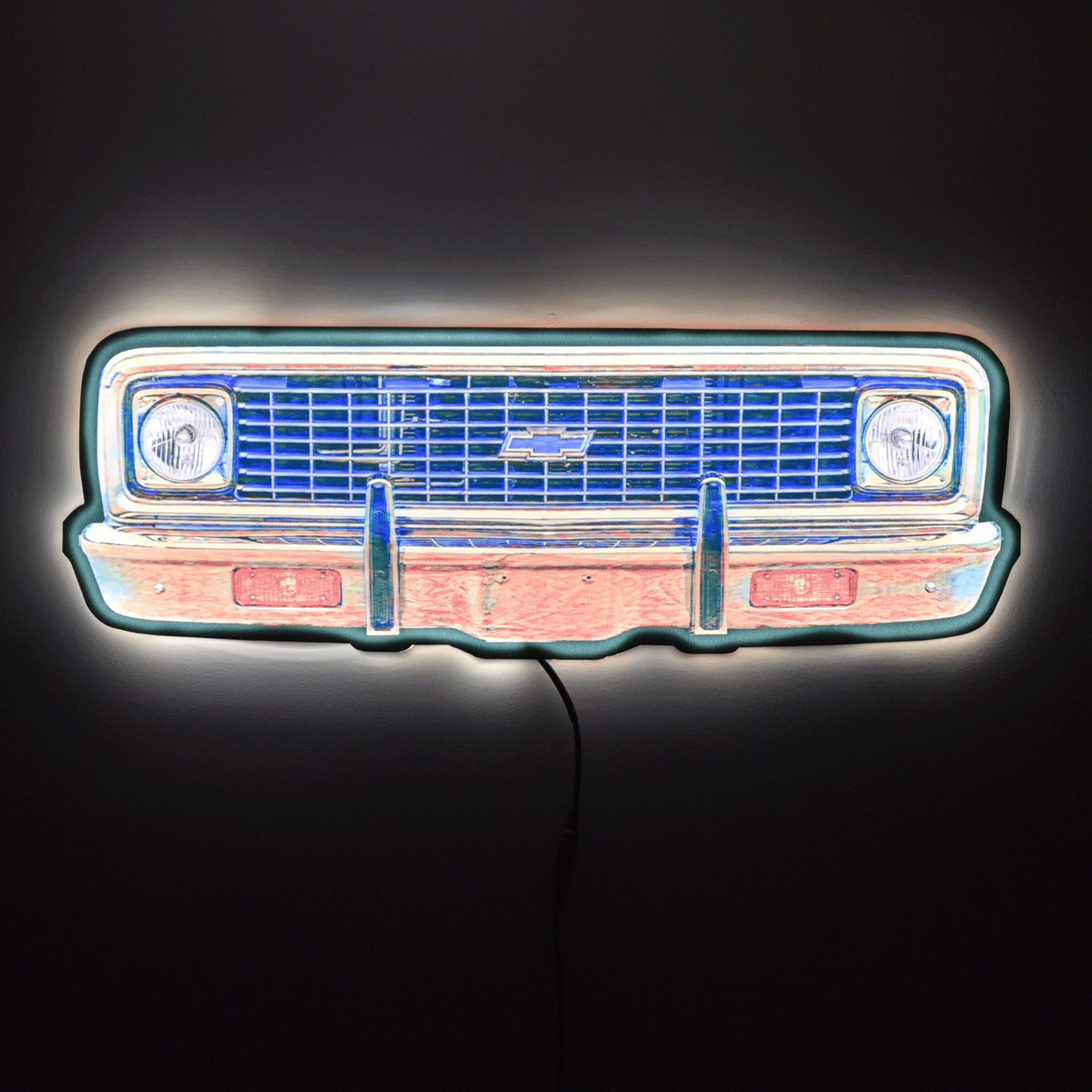 LED sign shaped like a classic truck grille on a black background