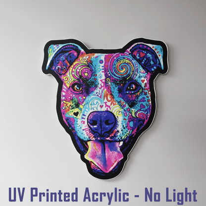 A UV-printed acrylic Colorful Smiling Pit Bull Face with tongue hanging out
 sign with a black outline, displayed against a light gray wall. Purple text at the bottom reads 'UV Printed Acrylic - No Light'