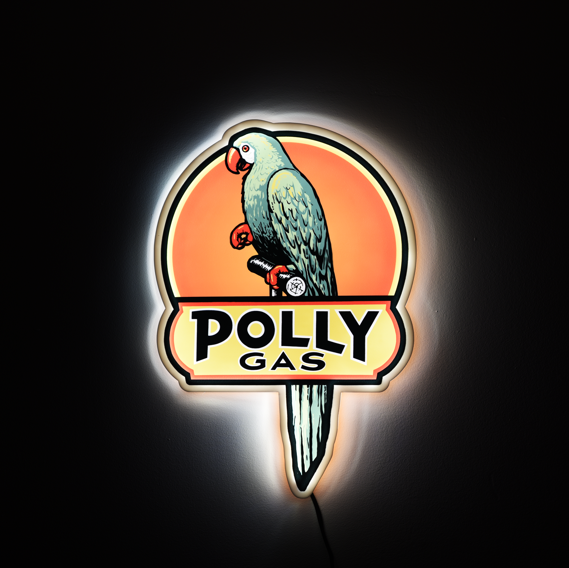 Neon sign of a parrot with 'Polly Gas' text on a dark background