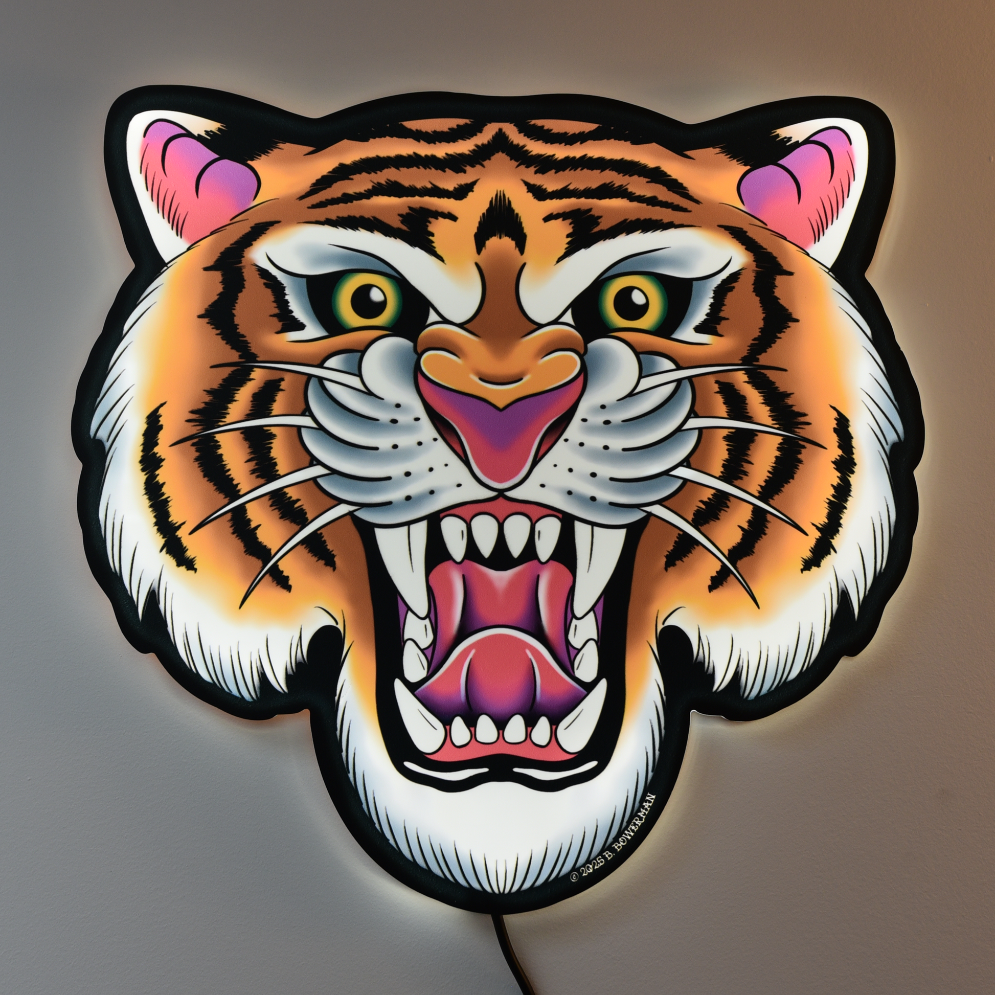 Original tiger design tattoo tacker by Bryce Bowerman wall light with LED light on which glows making tiger pop on a neutral background in a lit room