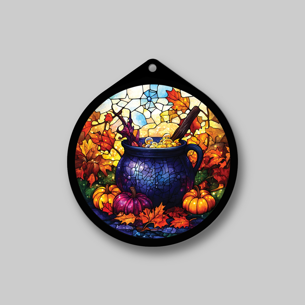 Witch's cauldron faux stained glass sign with pumpkins, hanging on a wall
