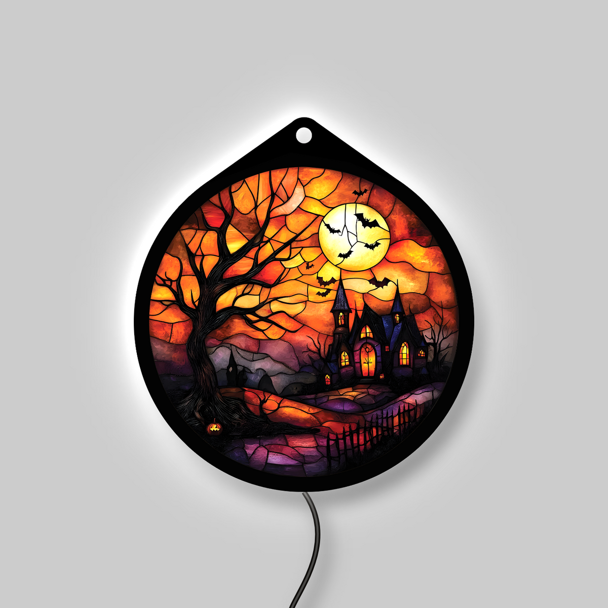 Haunted tree and moon LED sign glowing with backlight on