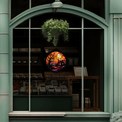 Haunted tree and moon sign unlit, hanging in a shop window display, alternate view