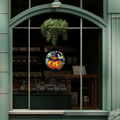 Jack-o'-lantern witch hat sign unlit in a shop window display, wide view