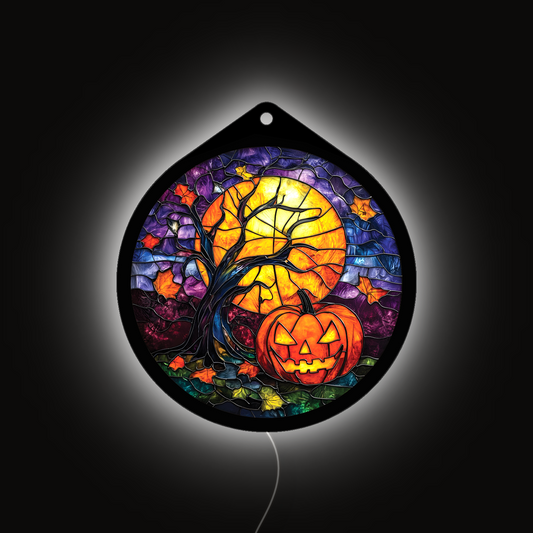 Pumpkin harvest moon LED sign glowing brightly against a dark background