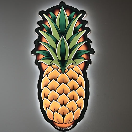 LED light on and off to illuminate  Original large Pineapple tattoo design by Bryce Bowerman in a room with lights on then off