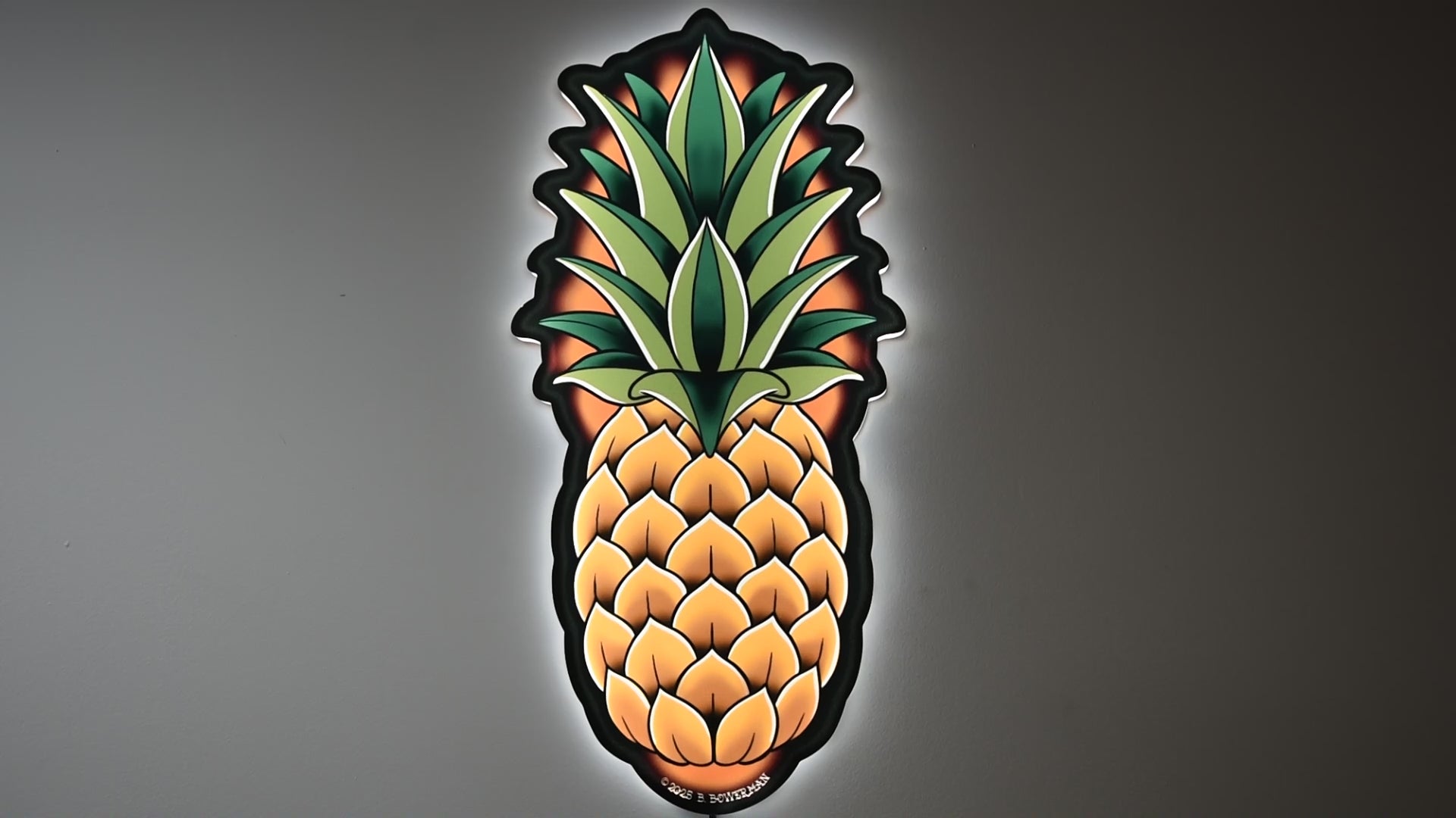 LED light on and off to illuminate  Original large Pineapple tattoo design by Bryce Bowerman in a room with lights on then off