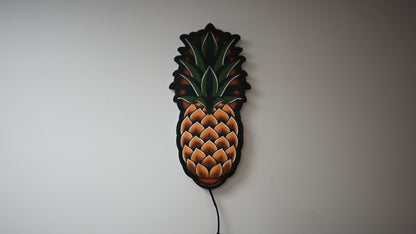 LED light on and off to illuminate  Original medium size Pineapple tattoo design by Bryce Bowerman in a room with lights on then off