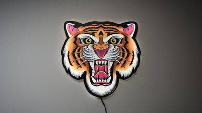 Video showing Tiger Tattoo Tacker by Bryce Bowerman turned on and off in a lighted room and a dark room to demonstrate how well the art is highlighted whether it is on or off