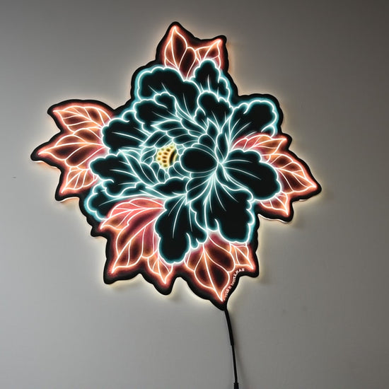 LED light on and off with room light on and off to show illumination of Original Peony tattoo design by Bryce Bowerman printed on acrylic with UV printer with added LED light.